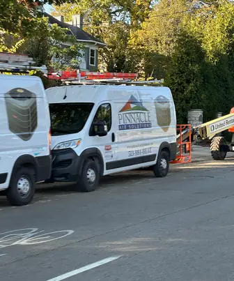 Pinnacle Air Solutions branded service van on a Cincinnati job site