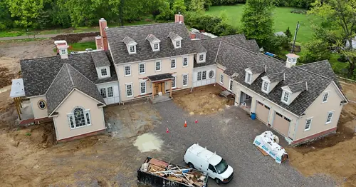 Aerial view of a new construction home with HVAC rough-in underway near Cincinnati