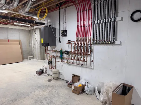 Radiant heating boiler and manifold installation with zone control wiring